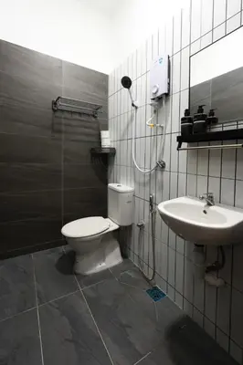 a bathroom with a shower and a toilet and a sink at The Cintra Muse Hotel at Central of Georgetown and UNESCO in George Town