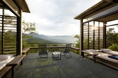 a screened in porch with a view of the mountains at Mountain View Getaway House with Pool Lauhaus 1 in Kuala Kubu Baharu