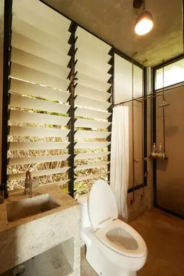 a bathroom with a toilet and a sink and a shower at Mountain View Getaway House with Pool Lauhaus 1 in Kuala Kubu Baharu