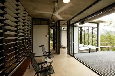 a room with a wall of wine racks at Mountain View Getaway House with Pool Lauhaus 1 in Kuala Kubu Baharu
