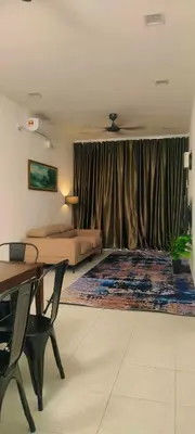 a bedroom with a bed and a desk and a table at Homestay odah dan hana teluk intan 3R2T in Teluk Intan