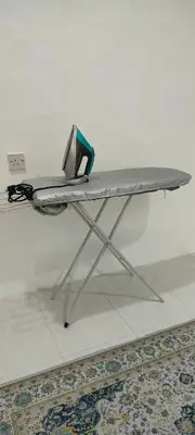 a table with a laptop sitting on top of it at Homestay odah dan hana teluk intan 3R2T in Teluk Intan