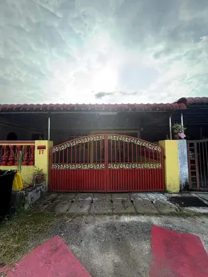 a red gate in front of a house at BUDI HOMESTAY Meru Jaya in Ipoh