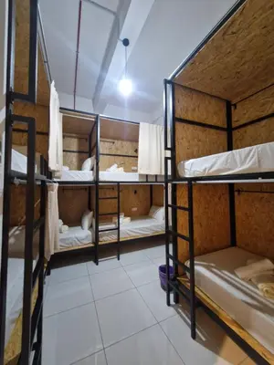 a room with three bunk beds in a hostel at Amore Stay by BNB4U in George Town