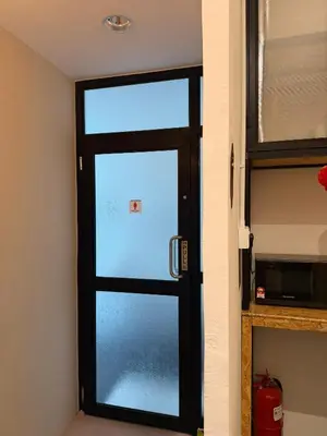 a door with a glass window in a room at Amore Stay by BNB4U in George Town