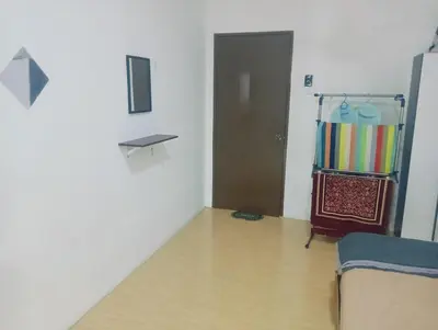 a room with a room with a door and a wooden floor at HomeStay YNS Kampar Putra Perak 2 Bilik dan 2 Bilik Air in Kampar