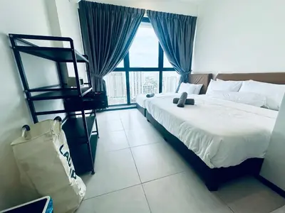 a bedroom with a bed and a large window at Urban Suites 3R2B 11pax Deluxe Living Room in George Town