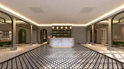 a lobby with a counter in the middle of a room at Stallionz Leisure Suites Ipoh in Ipoh