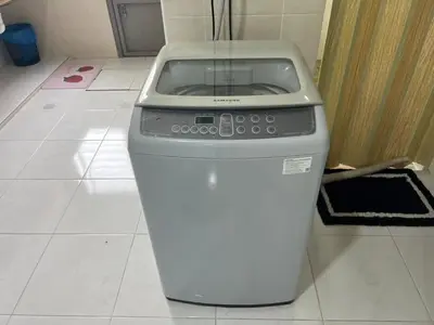 a trash can sitting on a tiled floor at LAMAN SUZY Seri Iskandar in Seri Iskandar