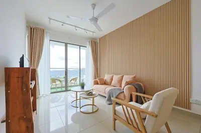 a living room with a couch and a table at Muji Style Top 5 Palas Horizon Brinchang Cameron Highlands - C Home Luxury A-5-04 in Brinchang