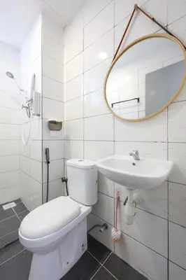 a white bathroom with a toilet and a sink at Muji Style Top 5 Palas Horizon Brinchang Cameron Highlands - C Home Luxury A-5-04 in Brinchang