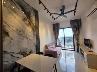 a living room with a large marble wall at Piccadilly Greentown Ipoh in Ipoh