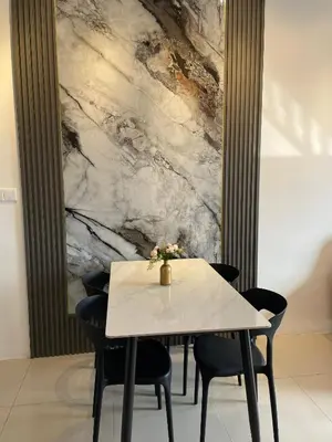 a dining room with a white table and chairs at Piccadilly Greentown Ipoh in Ipoh