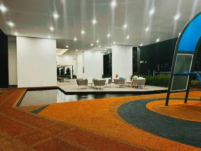 a lobby of a building with a table and chairs at Elegant 3BR Luxury City View Comfortable for 10 in George Town