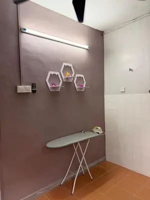a bathroom with a table and a wall with three shelves at PRS Homestay in Chemor