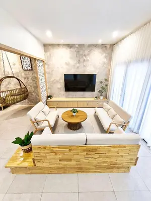 a living room with a couch and a table at Ipoh Santorini Pool Villa 4BR 15pax by One Life Four Season Guesthouse in Ipoh