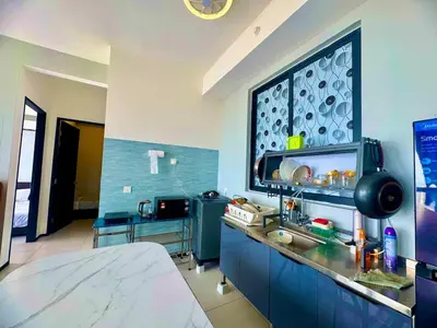 a kitchen with a large window in a room at Luxury 3BRHighFloor CityView10 Pax StylishSpacious in George Town