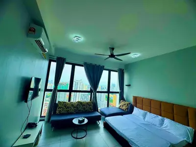 a bedroom with a bed and a ceiling fan at Luxury 3BRHighFloor CityView10 Pax StylishSpacious in George Town