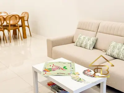 a living room with a couch and a table at Ipoh Gunung Lang Mooncave Spacious 4BRHouse with 5 Queen Beds in Ipoh