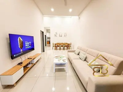 a white living room with a couch and a tv at Ipoh Gunung Lang Mooncave Spacious 4BRHouse with 5 Queen Beds in Ipoh