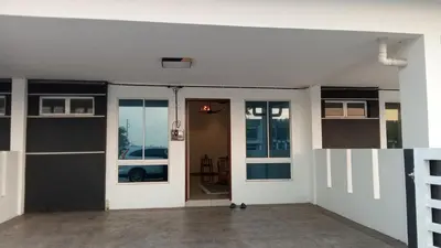 an empty garage with a door and windows at Rara Homestay in Kampong Selamat