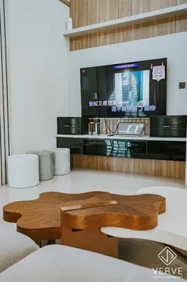 a living room with a table and a tv at Ipoh Midtown 33 Funhouse by Verve in Ipoh