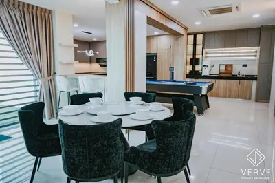 a dining room with a ping pong table and chairs at Ipoh Midtown 33 Funhouse by Verve in Ipoh