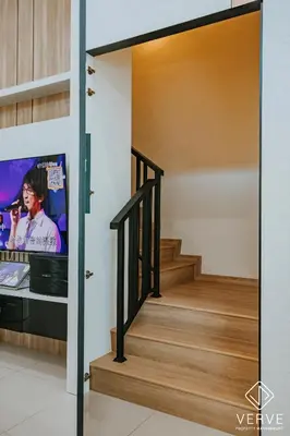 a staircase in a house with a tv at Ipoh Midtown 33 Funhouse by Verve in Ipoh