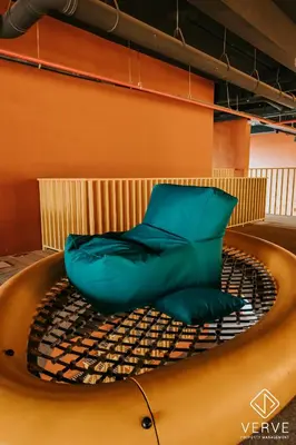 a green chair sitting on top of a boat at Ipoh Town Piccadilly Premium Suites by Verve 3B2B in Gua Sai