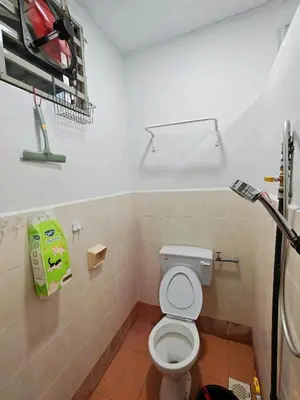 a bathroom with a white toilet in a room at Yoland Homestay Baling Kedah in Baling