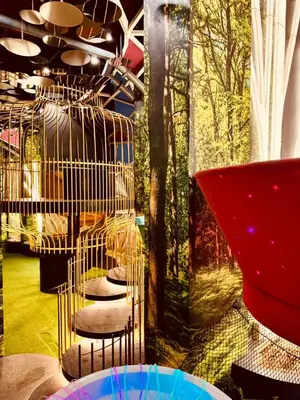 a room with a bunch of birds in a cage at Private Apartment in Kuala Lumpur in Gua Sai