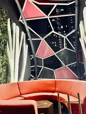 a couch sitting in front of a building with a window at Private Apartment in Kuala Lumpur in Gua Sai