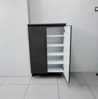 a black cabinet with white shelves in a room at Kinta Olive in Ipoh