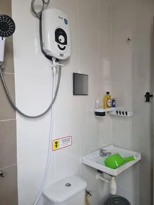 a shower in a bathroom with a toilet and a sink at Room Stay YNS Kampar Putra 1 Bilik dan Bilik Air in Kampar