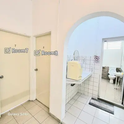 a bathroom with a sink and a toilet at Spacious 9 Rooms house 23paxQbay MallSpice Arena in Gelugor