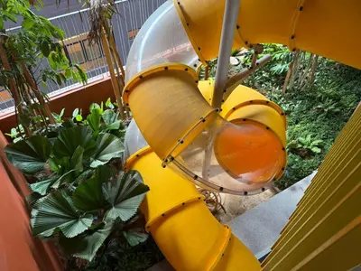 a yellow fire hydrant sitting next to some plants at N0ir Blanc Piccadilly Ipoh Town 3R2B 6-7pax in Ipoh