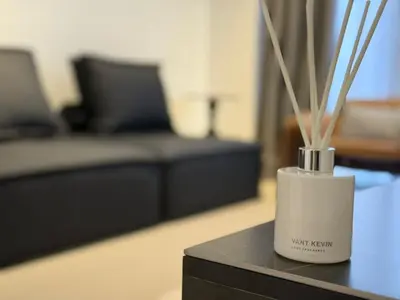 a vase with sticks in it sitting on a table at N0ir Blanc Piccadilly Ipoh Town 3R2B 6-7pax in Ipoh