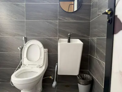 a bathroom with a toilet with the lid up at Rustic Vibe Pool Bungalow Karaoke 5R7B for 22pax in Ipoh