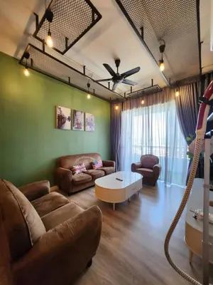 a living room with a couch and a table at The Majestic Condo Ipoh in Ipoh