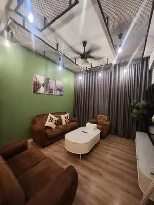 a living room with a couch and a coffee table at The Majestic Condo Ipoh in Ipoh