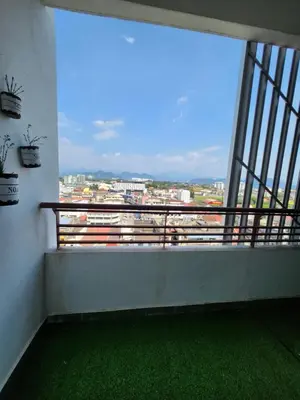 a balcony with a large window with a view of a city at The Majestic Condo Ipoh in Ipoh