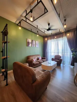 a living room with a couch and a table at The Majestic Condo Ipoh in Ipoh