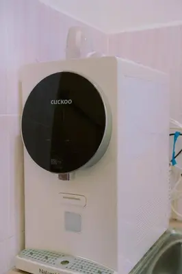 a close up of a white microwave on a counter at Wewe Homestay CL2 in Kampung Gajah