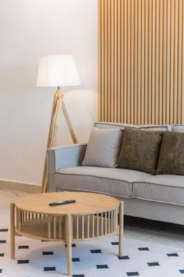 a living room with a couch and a coffee table at Serene Muji Family Retreat 2-7 pax with Comfortable Living Space in Tanah Rata