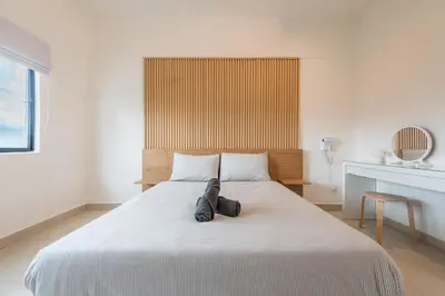 a bedroom with a bed with a backpack on it at Serene Muji Family Retreat 2-7 pax with Comfortable Living Space in Tanah Rata