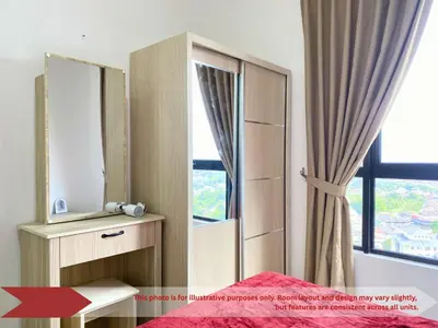 a bedroom with a mirror and a bed and a window at The Piccadilly Greentown Residences Ipoh in Ipoh