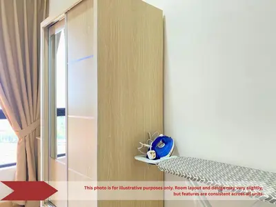 a room with a book shelf and a window at The Piccadilly Greentown Residences Ipoh in Ipoh