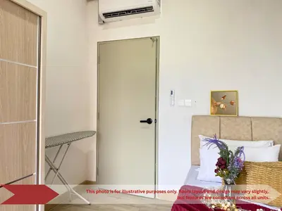 a glass door leading to a bedroom with a bed at The Piccadilly Greentown Residences Ipoh in Ipoh