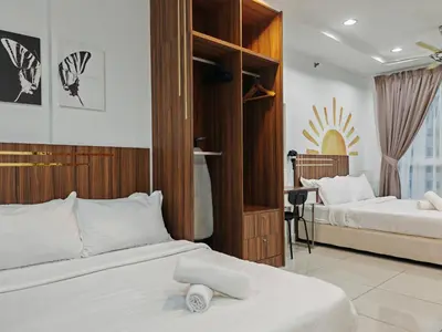 a bedroom with two beds and a desk at Mansion One Studio VIP Parking Gleneagles Gurney in George Town