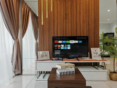a living room with a large tv and a table at Mansion One Studio VIP Parking Gleneagles Gurney in George Town